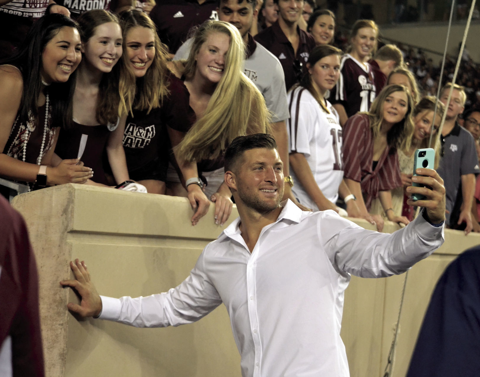 AT Tebow and the girls.jpg